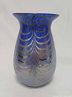 Front view of cobalt blue iridescent pulled feather art glass vase
