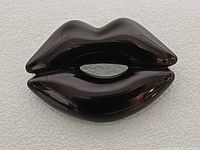 front view of lips brooch
