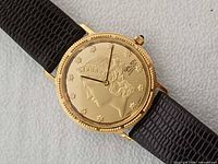 Front view of Gruen Liberty Coin watch showing dial design and gold-tone case