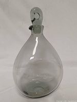 Front view of smoke gray decanter with stopper