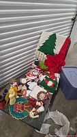 bench view showing full assortment of Christmas textiles and decorations