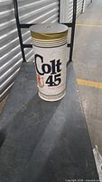 Full view of Colt 45 inflatable on cart showing logo and overall shape