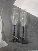Pair of champagne flutes standing side by side