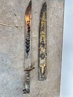 Full view of dagger and scabbard side by side