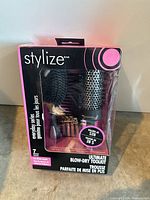 Retail package front showing brushes and clips