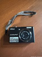 Front view showing lens specs, megapixel and zoom details