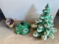 entire lot showing tree top, base, container of peg lights