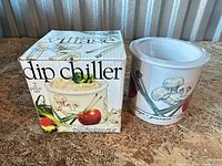 Dip chiller beside original box showing product name and art