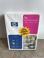 Front view of sealed HP multipurpose paper ream showing size, sheet count, weight, brightness