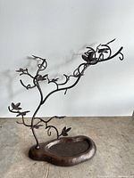 Full view of metal jewelry tree on base