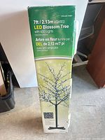 Retail box showing 7 ft LED blossom tree specifications and image