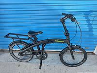 Full left side view of folded-frame bicycle showing overall condition and components