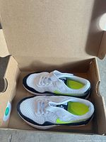 Top view of both shoes in box