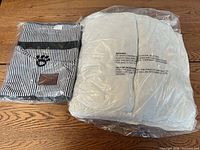 Striped cover and grey cushion sealed in plastic