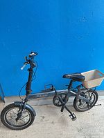 Full left-side view of Solorock Swift folding bicycle with basket