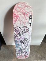 Underside of Trickster deck showing pink splatter and bird graphic