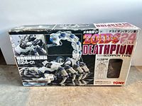 Front of Zoids24 Deathpion box showing graphic, model name, scale and brand