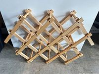 Front view of folded wooden lattice wine rack