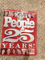 Front cover showing title, 25 Years text and celebrity images