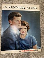 Front cover of 1963 The Kennedy Story Philadelphia Inquirer Memorial Supplement featuring color portrait of President John F. Kennedy and Jacqueline Kennedy