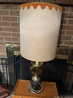 Full view of lamp with shade showing overall height and style