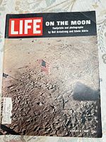 Front cover showing Life logo, lunar surface photo, flag, date and price