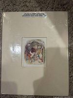 Front view of shrink-wrapped matted print with label