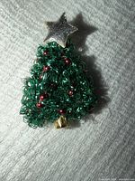Front view of wire Christmas tree brooch