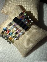 Front view of wrap bracelet showing bead variety and stacked coils