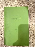 Front cover of green softcover Holy Bible