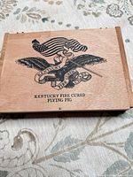 Closed cigar box showing lid graphics