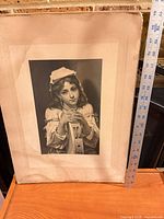 Full view of portrait print with ruler for scale