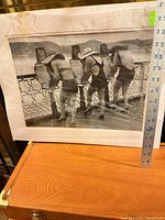 Full view of matted photograph with ruler for scale