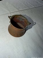 Oblique top view of copper pot showing overall form and patina