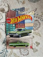 Front of sealed Hot Wheels card showing green ‘72 Ford Ranchero die-cast car
