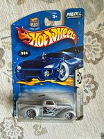 Front of sealed Hot Wheels car on card showing artwork and car