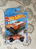 Front view of sealed Hot Wheels '87 Dodge D100 on card