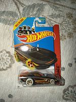 Front view of sealed Hot Wheels HW Race die-cast car on card