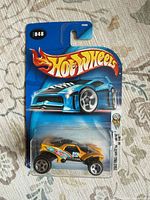 Front view of sealed Hot Wheels Rally Baja Beetle #048 blister pack