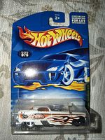 Front of sealed Hot Wheels blister showing car and card art