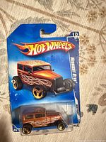 Front of sealed Hot Wheels Midnight Otto on card