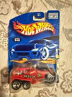 Front of sealed Hot Wheels card showing red Rescue car and collector number 040
