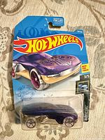 Front view of sealed Hot Wheels Forward Force car on blister card