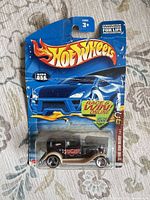 Front view of sealed Hot Wheels '32 Ford Delivery card showing car details