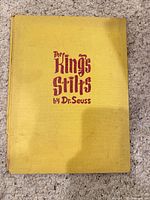 Front cover showing yellow cloth and red stamped title