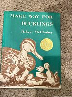 Front cover of book with dust jacket and Caldecott seal