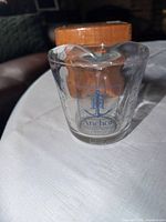 Front view showing Anchor logo and clear glass body