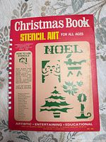 front cover showing title, publisher, sample stencil motifs, comb binding