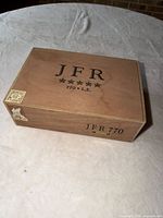 Closed box top view showing JFR 770 L.E. branding and corner stamp