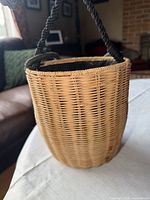 Full view of wicker purse showing body weave and lining